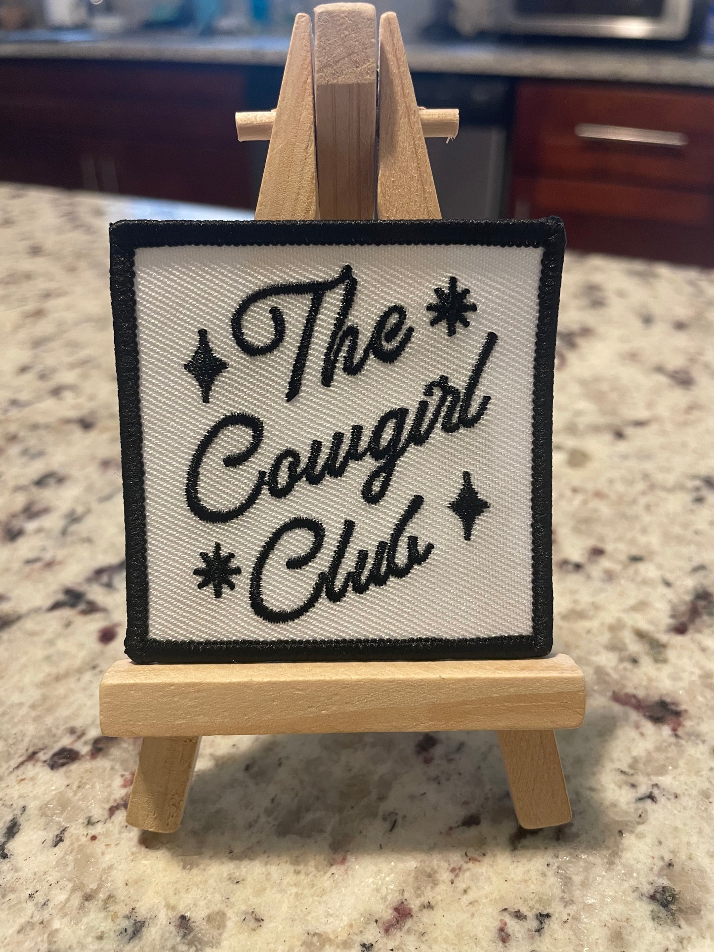 The cowgirl club embroidered iron on patch